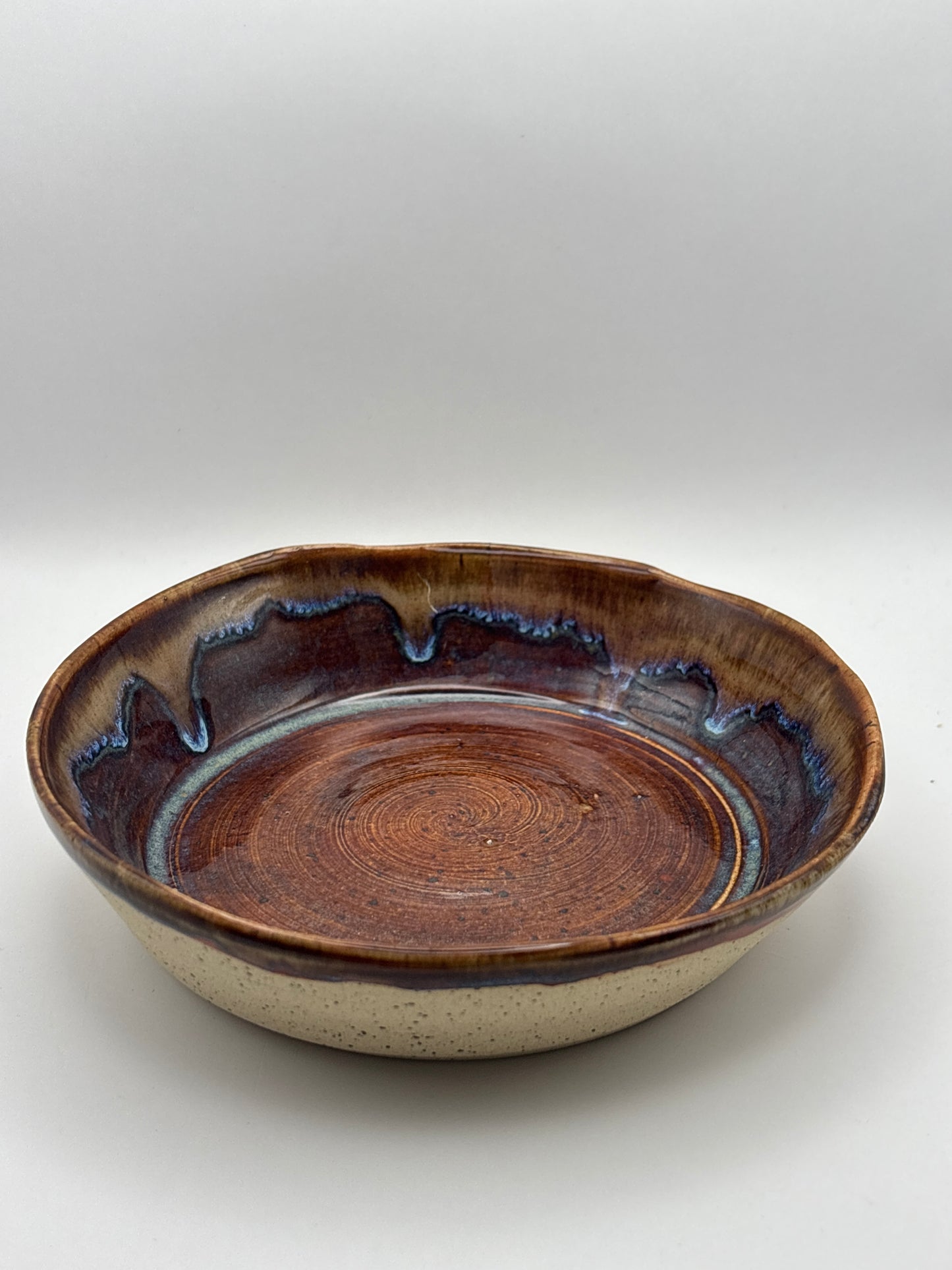 Hand-Thrown Shallow Stoneware Bowl in Warm Brown with Blue Drip Rim by Gin