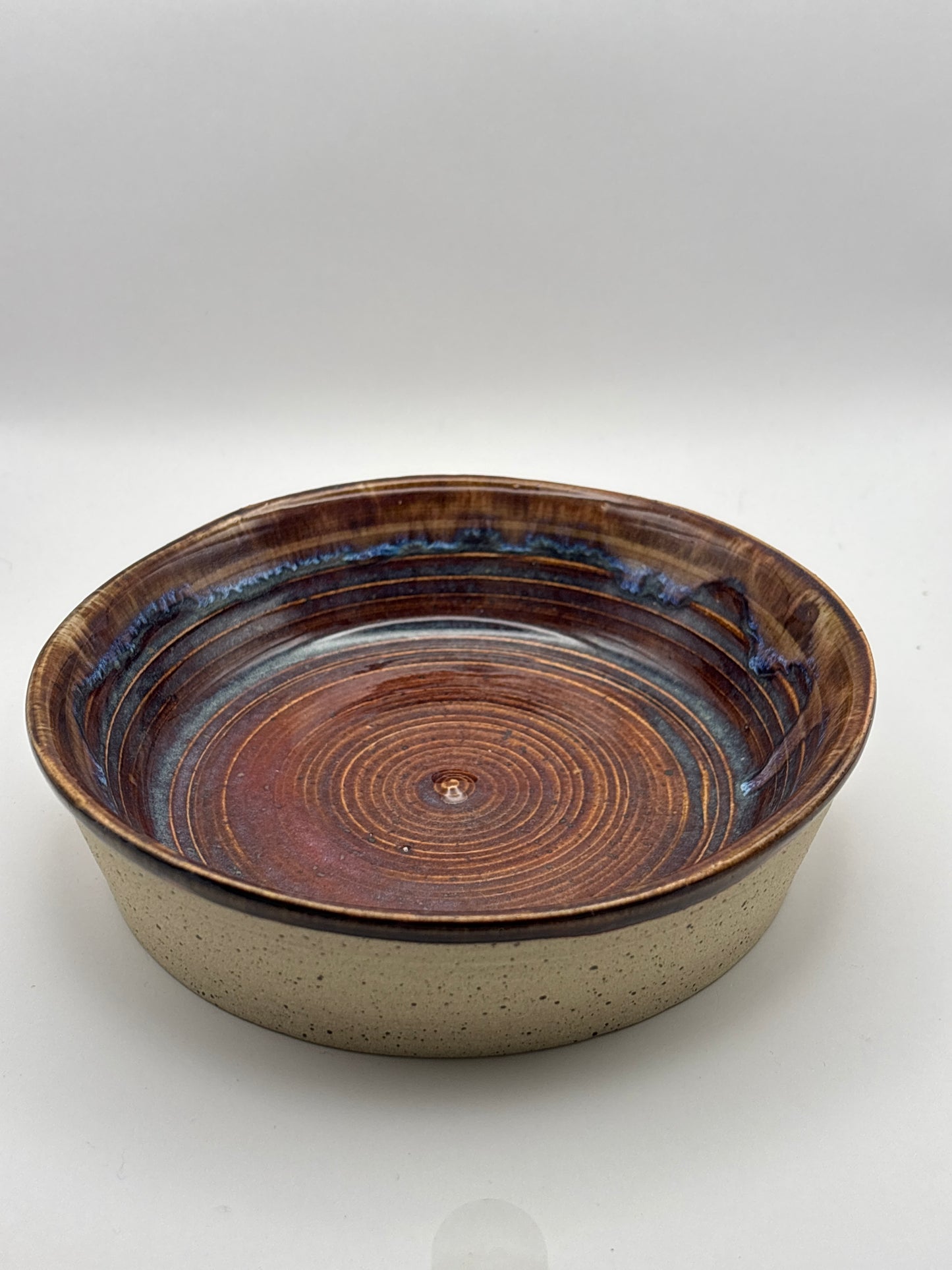 Hand-Thrown Shallow Stoneware Bowl in Rich Brown Spiral with Blue Rim Bands by Gin