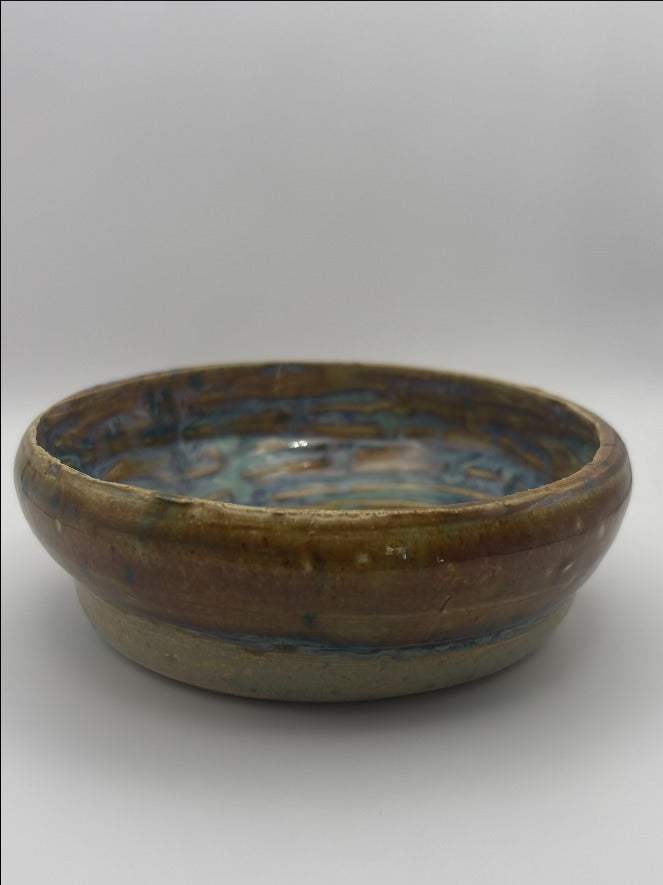 A Small Handcrafted Ceramic Bowl with Mesmerizing Swirl Glaze